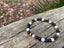 Bracelet élastique de Lithothérapie "Triple Protection" Oeil de tigre, Pierre de Lave et Howlite Blanche
