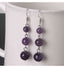 Boucles d'oreilles pendantes 3 boules en Améthyste