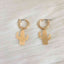 Boucles d'oreilles créoles motif étoile du Nord