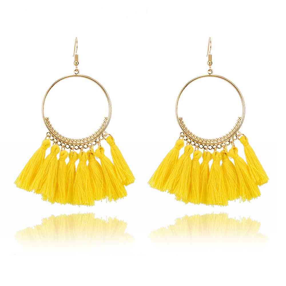 Boucles d'oreilles créoles dorées pompons style bohême chic