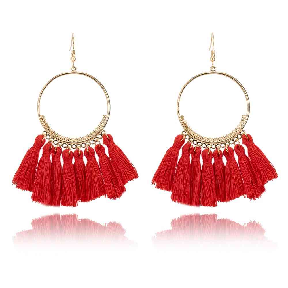 Boucles d'oreilles créoles dorées pompons style bohême chic