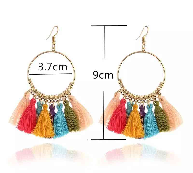 Boucles d'oreilles créoles dorées pompons style bohême chic
