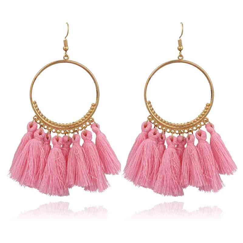 Boucles d'oreilles créoles dorées pompons style bohême chic