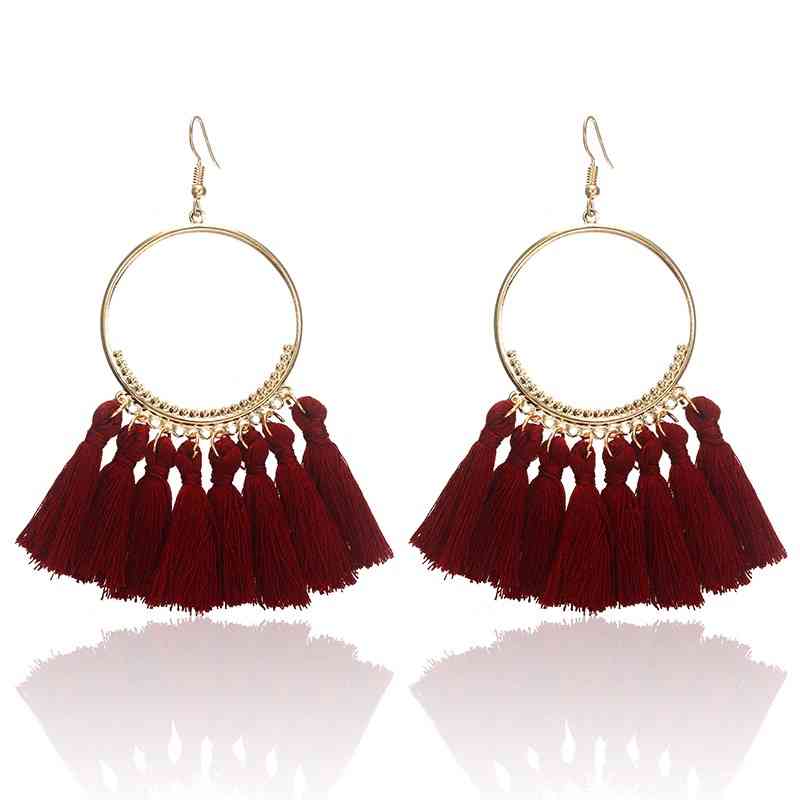 Boucles d'oreilles créoles dorées pompons style bohême chic
