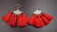 Boucles d'oreilles ethniques orientales en argent Tibétain et pompons rouges
