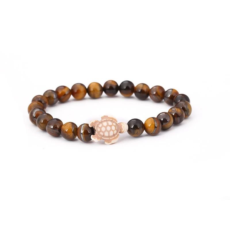 Bracelet en Oeil de Tigre de Madagascar 8 mm + tortue Amérindienne en Howlite Blanche
