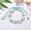 Chaîne de cheville bleue avec coquillages cauris