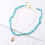 Collier en coquillage Cauri et perles en Howlite Turquoise