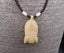 Collier avec pendentif os de buffle sculpté et gravé masque Africain