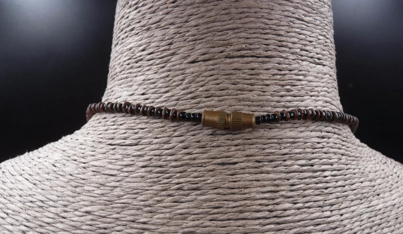 Collier avec pendentif os de buffle sculpté et gravé masque Africain