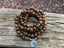 Bracelet Mala Tibétain de méditation 108 perles en bois Wengé et breloque Lotus