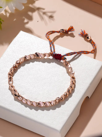 Bracelet de chance en perles de cuivre rose - façon Bouddhisme Tibétain