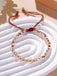 Bracelet de chance en perles de cuivre rose - façon Bouddhisme Tibétain