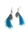 Boucles d'oreilles pompons bleu turquoises et main de Fatma