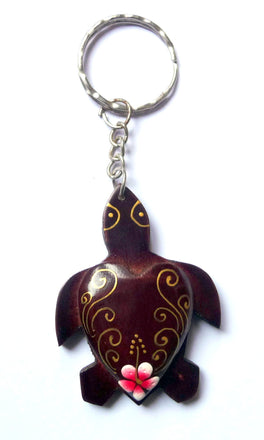 Porte-clés tortue en bois peint motif fleur de frangipanier