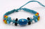  BRACELET EN COTON CIRÉ ET PERLES