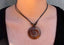 Collier avec pendentif spirale en bois exotique sur cordon ajustable perles coco