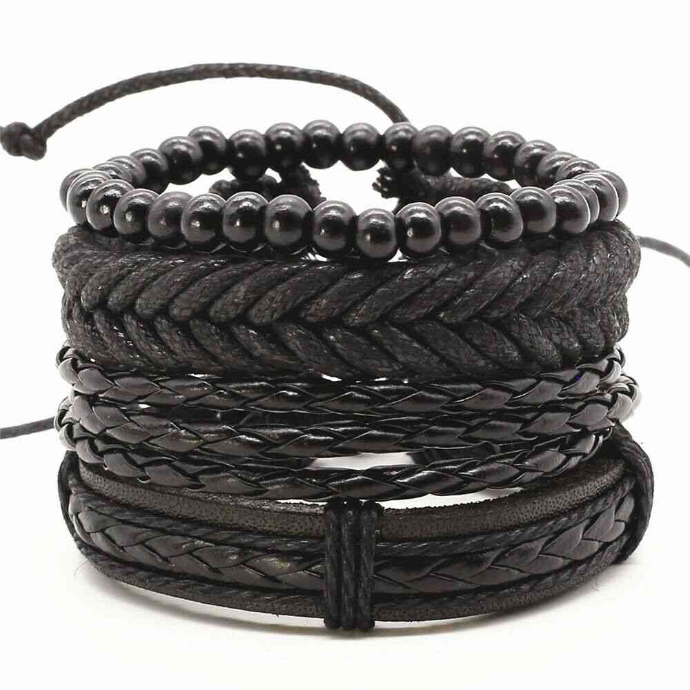 Manchette pour homme. Ensemble de 4 bracelets noirs très tendance.