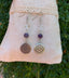 Boucles d'oreilles en Cristal de roche et Améthyste motif Fleur de vie