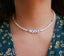 Collier LOVE en perles blanches et oeil porte bonheur