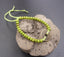 Bracelet feng shui vert anis en perles de bois et pièce chinoise porte bonheur
