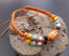 Bracelet ethnique en coton ciré orange et os de buffle