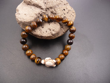 Bracelet en Oeil de Tigre de Madagascar 8 mm + tortue Amérindienne en Howlite Blanche