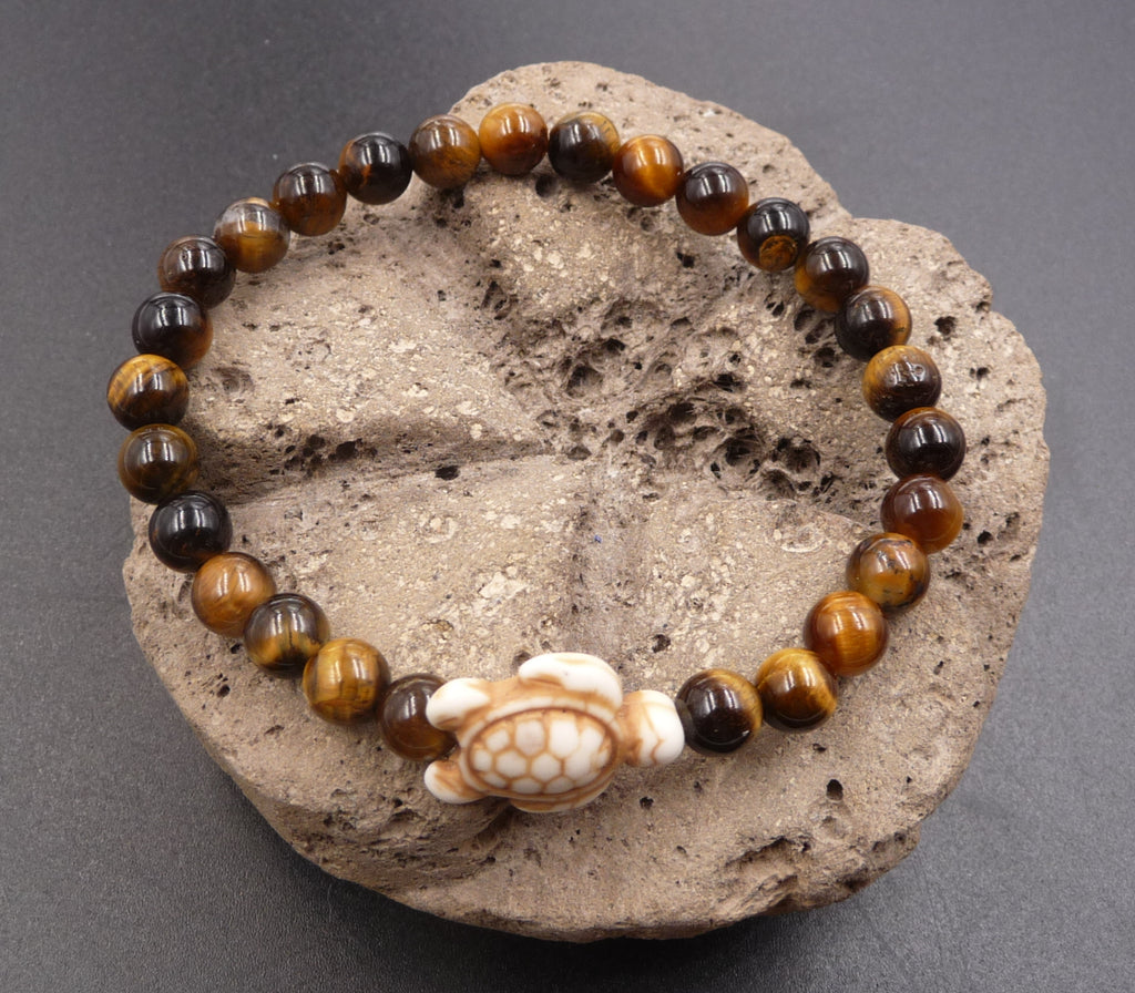 Bracelet en Oeil de Tigre de Madagascar 6 mm + tortue Amérindienne en Howlite Blanche