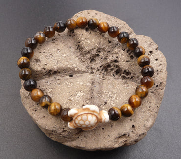 Bracelet en Oeil de Tigre de Madagascar 6 mm + tortue Amérindienne en Howlite Blanche