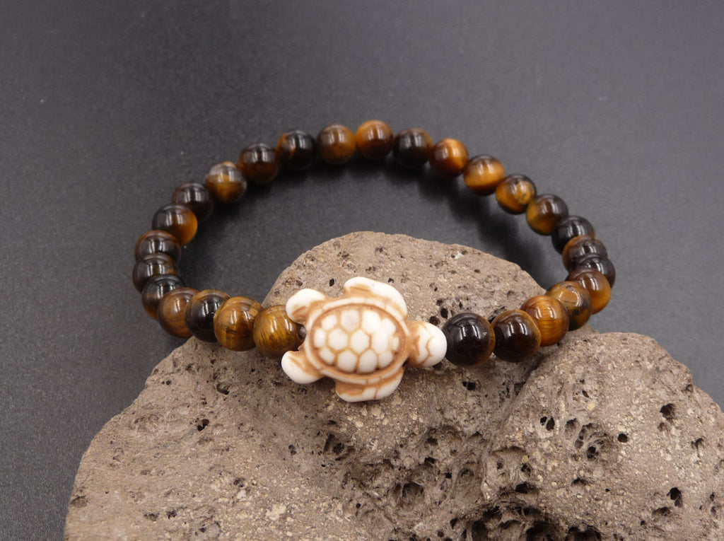 Bracelet en Oeil de Tigre de Madagascar 6 mm + tortue Amérindienne en Howlite Blanche