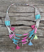 Collier multirangs bohème boho gipsy avec pompons et perles