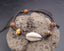 Bracelet bohème en coquillage cauri naturel et perles en bois