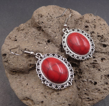 Boucles d'oreilles ethniques orientales en howlite rouge artisanat Maroc