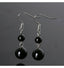 Boucles d'oreilles pendantes 2 boules en Onyx