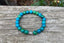 Bracelet Lithothérapie en Chrysocolle du Pérou et breloque Bouddha argentée - Pierre tranquille - Boules 8 mm