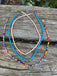 Ensemble de 3 colliers en perles. Turquoise, multicolore et rose