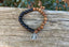 Bracelet élastique en bois Wengé, onyx mat et breloque Lotus Bouddha