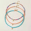 Ensemble de 3 colliers en perles. Turquoise, multicolore et rose