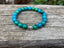 Bracelet Lithothérapie en Chrysocolle du Pérou et breloque Bouddha argentée - Pierre tranquille - Boules 8 mm