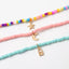 Ensemble de 3 colliers en perles. Vert d’eau, multicolore et rose